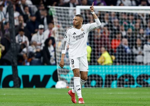Kylian Mbappà of Real Madrid celebrates scoring the opening goal for their side Real Madrid v Manchester City, UEFA Champions League, Knockout Round Play-offs, Second Leg, Football, Santiago BernaboÆ?Ã?Æ?o Ã? u, Madrid, Spain - 19 Feb 2025 EDITORIAL USE ONLY No use with unauthorised audio, video, data, fixture lists, club league logos or live services. Online in-match use limited to 120 images, no video emulation. No use in betting, games or single club league player publications. Copyright: xRubenxAlbarran Shutterstockx 15137179j
