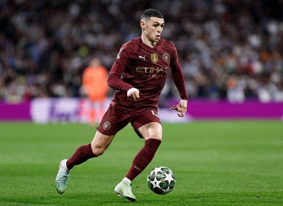 Phil Foden of Manchester City Real Madrid v Manchester City, UEFA Champions League, Knockout Round Play-offs, Second Leg, Football, Santiago BernaboÆ?Ã?Æ?o Ã? u, Madrid, Spain - 19 Feb 2025 EDITORIAL USE ONLY No use with unauthorised audio, video, data, fixture lists, club league logos or live services. Online in-match use limited to 120 images, no video emulation. No use in betting, games or single club league player publications. Copyright: xRubenxAlbarran Shutterstockx 15137179ac