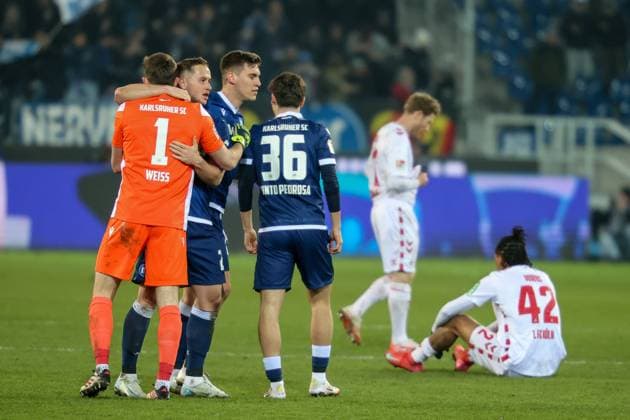Max Weiss Karlsruher SC, Goalkeeper 01 celebrates after whistle Damion Downs 1 FC Koeln, 42 on the ground, Karlsruher SC vs 1 FC Koeln Football, 2 Bundesliga, 24 Matchday, 2024 2025, 01 03 2025, DFL REGULATES PROHIBIT ANY USE OF PHOTOGRAPHS AS IMAGE SEQUENCES AND OR QUASI VIDEO, Karlsruher SC vs 1 FC Koeln Football, 2 Bundesliga, 24 Matchday, 2024 2025, 01 03 2025 Karlsruhe Copyright: xEibner-Pressefoto JanxPrihodax EP_JPA