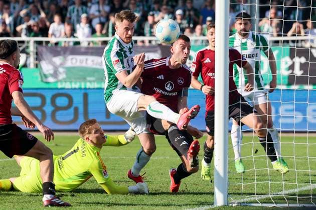 Charalambos Makridis SC Preussen Muenster and Robin Knoche 1 FC Nuernberg battle for the ball, 2 Bundesliga, Preußen Münster vs 1 FC Nürnberg, Preußenstadion, March 09, 2025 in Münster, Germany Photo by Marco Steinbrenner DeFodi Images Charalambos Makridis SC Preussen Muenster and Robin Knoche 1 FC Nuernberg battle for the ball, 2 Bundesliga, Preußen Münster vs 1 FC Nürnberg, Preußenstadion, March 9, 2025 in Münster, Germany Photo by Marco Steinbrenner DeFodi Images DFB DFL REGULATIONS PROHIBIT ANY USE OF PHOTOGRAPHS AS IMAGE SEQUENCES AND OR QUASI VIDEO