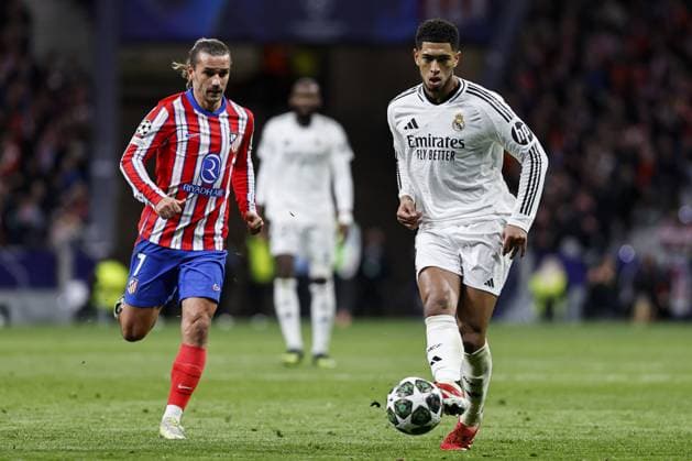 Jude Bellingham of Real Madrid under pressure from Antoine Griezmann of Atlà tico Madrid Atletico Madrid v Real Madrid, UEFA Champions League, Round of 16, Second Leg, Football, Riyadh Air Metropolitano Stadium, Madrid, Spain - 12 Mar 2025 EDITORIAL USE ONLY No use with unauthorised audio, video, data, fixture lists, club league logos or live services. Online in-match use limited to 120 images, no video emulation. No use in betting, games or single club league player publications. Copyright: xRubenxAlbarran Shutterstockx 15188186an