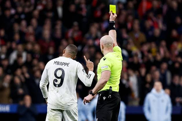 Kylian Mbappà of Real Madrid receives a yellow card Atletico Madrid v Real Madrid, UEFA Champions League, Round of 16, Second Leg, Football, Riyadh Air Metropolitano Stadium, Madrid, Spain - 12 Mar 2025 EDITORIAL USE ONLY No use with unauthorised audio, video, data, fixture lists, club league logos or live services. Online in-match use limited to 120 images, no video emulation. No use in betting, games or single club league player publications. Copyright: xRubenxAlbarran Shutterstockx 15188186ca