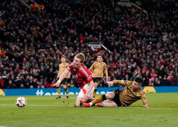 Manchester, England, 13th March 2025. Rasmus Hojlund of Manchester United, ManU is brought down to earn a penalty during the UEFA Europa League match Manchester United v Real Sociedad at Old Trafford, Manchester. Picture credit should read: Andrew Yates Sportimage EDITORIAL USE ONLY. No use with unauthorised audio, video, data, fixture lists, club league logos or live services. Online in-match use limited to 120 images, no video emulation. No use in betting, games or single club league player publications. SPI_020_AY_MANU_SOCIEDAD SPI-3744-0020