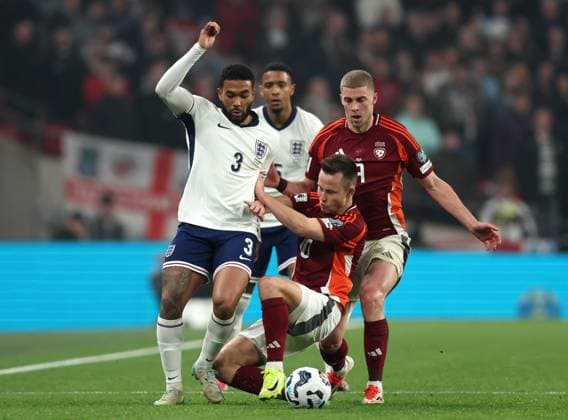 London, England, 24th March 2025. Reece James of England tackled by Janis Ikaunieks of Latvia during the FIFA World Cup, WM, Weltmeisterschaft, Fussball European Qualifying match at Wembley Stadium, London. Picture credit should read: David Klein Sportimage EDITORIAL USE ONLY. No use with unauthorised audio, video, data, fixture lists, club league logos or live services. Online in-match use limited to 120 images, no video emulation. No use in betting, games or single club league player publications. SPI_015_DK_England_Latvia SPI-3762-0017