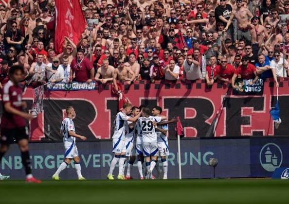 Hamburger SV goal celebration in front of the fans of 1 FC Nuernberg GER, 1 FC Nuernberg vs Hamburger SV, 2 Bundesliga, 28 Matchday, Season 2024 2025, 05 04 2025 DFL REGULATIONS PROHIBIT ANY USE OF PHOTOGRAPHS AS IMAGE SEQUENCES AND OR QUASI VIDEO GER, 1 FC Nuernberg vs Hamburger SV, 2 Bundesliga, 28 Matchday, Season 2024 2025, 05 04 2025 Nuernberg Copyright: xEibner-Pressefoto ScottxColemanx EP_SCN