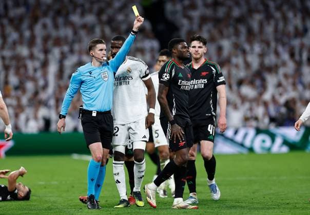Thomas Partey of Arsenal fouls Dani Ceballos of Real Madrid to earn a yellow card ruling him out of the first leg of a potential semi final vs PSG Real Madrid v Arsenal, UEFA Champions League, Quarter-Finals, 2nd Leg, Football, Santiago Bernabu Stadium, Madrid, Spain - 16 Apr 2025 EDITORIAL USE ONLY No use with unauthorised audio, video, data, fixture lists, club league logos or live services. Online in-match use limited to 120 images, no video emulation. No use in betting, games or single club league player publications. Copyright: xRubenxAlbarran Shutterstockx 15253938cx
