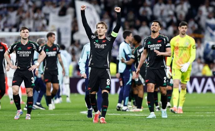 Martin Odegaard of Arsenal celebrates at full time Real Madrid v Arsenal, UEFA Champions League, Quarter-Finals, 2nd Leg, Football, Santiago Bernabu Stadium, Madrid, Spain - 16 Apr 2025 EDITORIAL USE ONLY No use with unauthorised audio, video, data, fixture lists, club league logos or live services. Online in-match use limited to 120 images, no video emulation. No use in betting, games or single club league player publications. Copyright: xRubenxAlbarran Shutterstockx 15253938ds