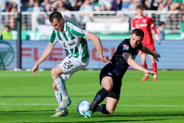 Niko Koulis SC Preussen Muenster and Jonjoe Kenny Hertha BSC Berlin battle for the ball, 2 Bundesliga, Preußen Münster vs Hertha BSC, Preußenstadion, May 9, 2025 in Münster, Germany Photo by Marco Steinbrenner DeFodi Images Niko Koulis SC Preussen Muenster and Jonjoe Kenny Hertha BSC Berlin battle for the ball, 2 Bundesliga, Preußen Münster vs Hertha BSC, Preußenstadion, May 9, 2025 in Münster, Germany Photo by Marco Steinbrenner DeFodi Images DFB DFL REGULATIONS PROHIBIT ANY USE OF PHOTOGRAPHS AS IMAGE SEQUENCES AND OR QUASI VIDEO