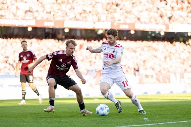 Florian Kainz FC Koeln, 11 in duel, GER, 1 FC Nuernberg FCN vs 1 FC Koeln KOE , Soccer 2 Bundesliga, 33 Matchday, Season 2024 2025, 09 05 2025 DFB DFL regulations prohibit any use of photographs as image sequences and or quasi video GER, 1 FC Nuernberg FCN vs 1 FC Koeln KOE , Soccer 2 Bundesliga, 33 Matchday, Season 2024 2025, 09 05 2025 Nuernberg Copyright: xEibner-Pressefoto Memmlerx EP_MMR