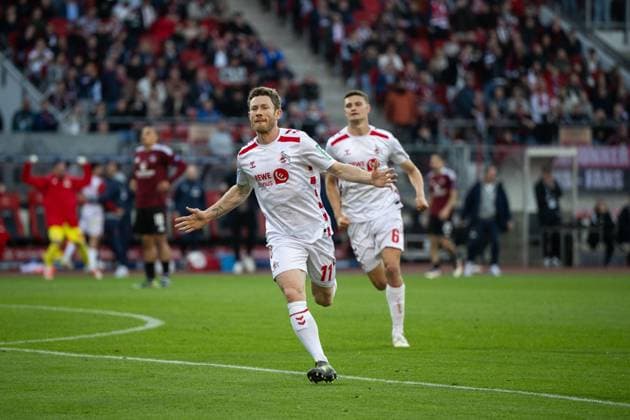 Florian Kainz FC Koeln, 11 , Eric Martel FC Koeln, 06 celebrating the goal for 1 1, GER, 1 FC Nuernberg FCN vs 1 FC Koeln KOE , Soccer 2 Bundesliga, 33 Matchday, Season 2024 2025, 09 05 2025 DFB DFL regulations prohibit any use of photographs as image sequences and or quasi video GER, 1 FC Nuernberg FCN vs 1 FC Koeln KOE , Soccer 2 Bundesliga, 33 Matchday, Season 2024 2025, 09 05 2025 Nuernberg Copyright: xEibner-Pressefoto Memmlerx EP_MMR