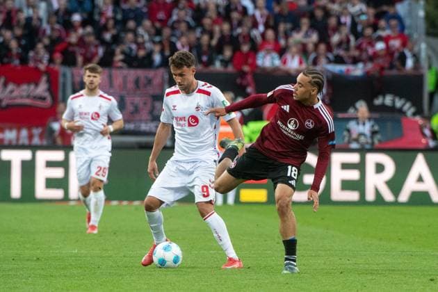 Luca Waldschmidt FC Koeln, 09 in duel with Rafael Lubach FC Nuernberg, 18 , GER, 1 FC Nuernberg FCN vs 1 FC Koeln KOE , Soccer 2 Bundesliga, Matchday 33, Season 2024 2025, 09 05 2025 DFB DFL regulations prohibit any use of photographs as image sequences and or quasi video GER, 1 FC Nuernberg FCN vs 1 FC Koeln KOE , Soccer 2 Bundesliga, Matchday 33, Season 2024 2025, 09 05 2025 Nuernberg Copyright: xEibner-Pressefoto Memmlerx EP_MMR