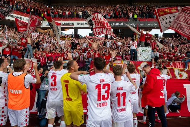 Marvin Schwaebe FC Koeln, 01 , Mark Uth FC Koeln, 13 , Florian Kainz FC Koeln, 11 , Dominique Heintz FC Koeln, 03 and team celebrate the victory and celebrate the possible promotion with the fans Ultras in the guest block, GER, 1 FC Nuernberg FCN vs 1 FC Koeln KOE , Football 2 Bundesliga, 33 Matchday, Season 2024 2025, 09 05 2025 DFB DFL regulations prohibit any use of photographs as image sequences and or quasi video GER, 1 FC Nuernberg FCN vs 1 FC Koeln KOE , Football 2 Bundesliga, 33 Matchday, Season 2024 2025, 09 05 2025 Nuernberg Copyright: xEibner-Pressefoto Memmlerx EP_MMR