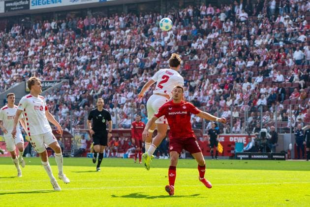 Duel between Benno Schmitz 1 FC Koeln, 02 and Daniel Hanslik 1 FC Kaiserslautern, 19 1 FC Koeln vs 1 FC Kaiserslautern, Football, 2 Bundesliga, Matchday 34, Season 2024 2025, 18 05 2025 DFL REGULATES PROHIBIT ANY USE OF PHOTOGRAPHS AS IMAGE SEQUENCES AND OR QUASI VIDEO 1 FC Koeln vs 1 FC Kaiserslautern, Football, Bundesliga 2, Matchday 34, Season 2024 2025, 18 05 2025 Koeln Copyright: xEibner-Pressefoto JustinxDerondex EP_JDU