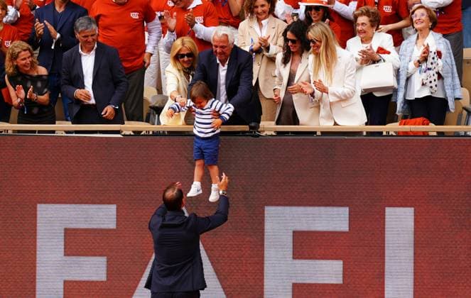 Rafa Nadal is honoured in a farewell ceremony on Philippe Chatrier Court and does a lap of honour on the famous court past his parents, his wife, sister and grandmothers as his son is lowered to him French Open Tennis, Day One, Tennis, Roland Garros, Paris, France - 25 May 2025 EDITORIAL USE ONLY No use with unauthorised audio, video, data, fixture lists, club league logos or live services. Online in-match use limited to 120 images, no video emulation. No use in betting, games or single club league player publications. Copyright: xJavierxGarcia Shutterstockx 15314618ca