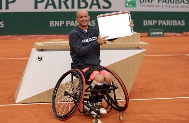 Guy Sasson of Israel celebrates with the trophy French Open Tennis, Day Fourteen, Tennis, Roland Garros, Paris, France - 07 Jun 2025 EDITORIAL USE ONLY No use with unauthorised audio, video, data, fixture lists, club league logos or live services. Online in-match use limited to 120 images, no video emulation. No use in betting, games or single club league player publications. Copyright: xEllaxLing Shutterstockx 15346222z