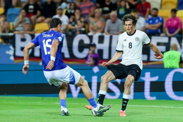 Diego Coppola Italy and Merlin Roehl Germany battle for the ball, UEFA European Under 21 Championship 2025 Quarter Final, Germany v Italy, MOL Arà na, June 22, 2025 in Dunajska Streda, Slovakia Photo by Marco Steinbrenner DeFodi Images Diego Coppola Italy and Merlin Roehl Germany battle for the ball, UEFA European Under 21 Championship 2025 Quarter Final, Germany v Italy, MOL Arà na, June 22, 2025 in Dunajska Streda, Slovakia Photo by Marco Steinbrenner DeFodi Images