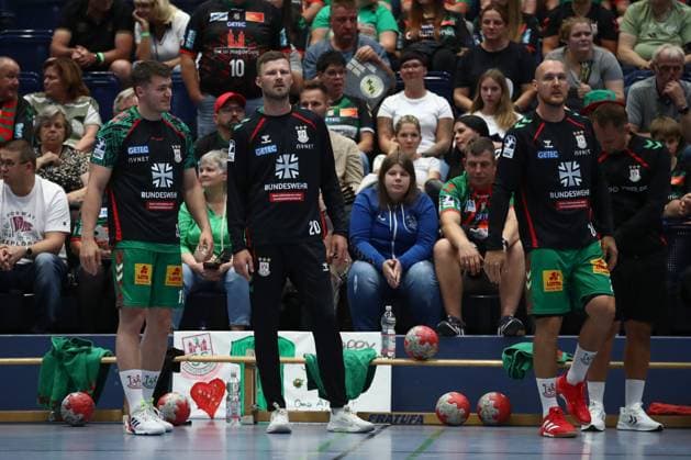 30 07 2025, xtgx, handball, test match, SC Magdeburg Fredericia Handboldklub v l Elvar Orn Jonsson Magdeburg, 19 , Philipp Weber Magdeburg, 20 , Christian O Sullivan Magdeburg, 24 SC Magdeburg advertises on the warm-up jerseys for the Bundeswehr symbol photo, symbol image, advertising, sponsor, Bundeswehr, army, military Ilsenburg