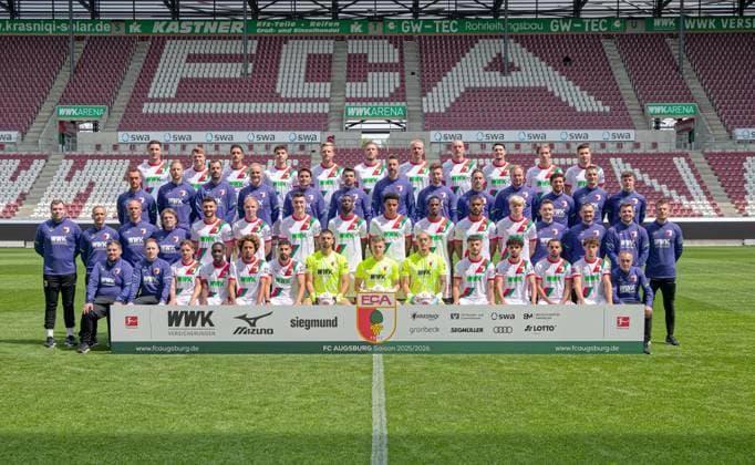 FC Augsburg 1907 1 BL, Porträttermin 2025 2026, Team photo, back row from left Keven Schlotterberck, Robin Fellhauer, Dimitrios Giannoulis, Mert Kömür, Arne Maier, Jeffrey Gouweleeuw, Phillip Tietz, Marius Wolf, Yusuf Kabadayi, Kristijan Jakic, Elvis Rexhbecaj Third row from left Rehab and Athletics Coach Andreas Bäumler, Head of Athletics Training, Co-Trainer Individual David Binder, Goalkeeping Coach Marco Langner, Co-Trainer Imre Szabics, Co-Trainer Thomas Kasparetti, Head Coach Sandro Wagner, Co-Trainer Sven Palinkasch, Co-Trainer Analysis Julian Lauer, Match and Video Analyst Felix Kling, Match and Video Analyst Benedikt Brust, Rehab and Athletics Coach Frank Roßner, Head of Physiotherapy Nikolaus Guschl Second row from left Team Coordinator Jan Reckord, Team Doctor Dr Karsten Bogner, Team Doctor Dr Jens Otto, Team Doctor Dr Andreas Weigel, Maximilian Bauer, Tim Breithaupt, Cedric Zesiger, Chrislain Matsima, Noahkai Banks, Samuel Essende, Steve Mounie, Felix Meiser, Rehab and Athletics Coach Christian Hahn, Physiotherapist David Müller, Physiotherapist Marcel Schoder, Physiotherapist Julian Binder Bottom row (from left to right) Team manager Christoph Schade, Team manager Philipp Dolla, Mads Pedersen, Kyliane Dong, Han Noah Massengo, Elias Saad, Nediljko Labrovic, Finn Dahmen, Daniel Klein, Mahmut Kücüksahin, Aiman Dardari, Alexis Claude Maurice, Oliver Sorg, Team manager Salvatore Belardo