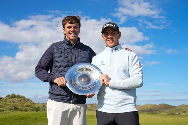Grant Forrest (SCO) holds the NEXO Championship trophy with his caddie Shane O Connell, left. Nexo Championship, Day Four, Golf, Trump International Golf Links, Aberdeenshire, Scotland, UK - 10 Aug 2025Aberdeenshire Trump International Golf Links Scotland United Kingdom EDITORIAL USE ONLY No use with unauthorised audio, video, data, fixture lists, club league logos or live services. Online in-match use limited to 120 images, no video emulation. No use in betting, games or single club league player publications. Copyright: xStuartxWallace Shutterstockx 15429702aw