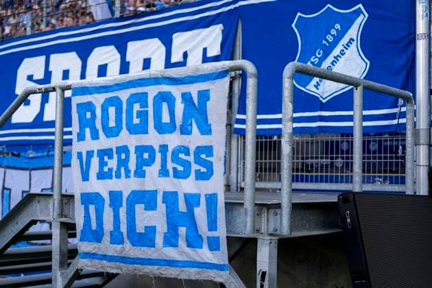 The Ultras of TSG 1899 Hoffenheim have hung a banner in front of the fan curve with the inscription Rogon verpiss dich, fans, audience, spectators, mood, atmosphere, stadium, protest, protest action against the consultant Roger Wittmann agency ROGON Sportmanagement , protest, Action, Action, 20 09 2025, Sinsheim Germany , Soccer, Bundesliga, TSG 1899 Hoffenheim FC Bayern Munich, DFB DFL REGULATIONS PROHIBIT ANY USE OF PHOTOGRAPHS AS IMAGE SEQUENCES AND OR QUASI VIDEO xozx