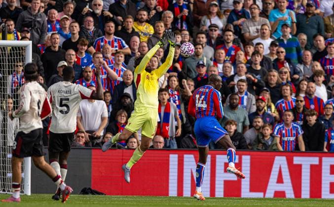 (250928) -- LONDON, Sept. 28, 2025 -- Liverpool s goalkeeper Alisson Becker (2nd R) makes a save from Crystal Palace s Jean-Philippe Mateta during the English Premier League match between Crystal Palace FC and Liverpool FC in London, Britain, on Sept. 27, 2025. FOR EDITORIAL USE ONLY. NOT FOR SALE FOR MARKETING OR ADVERTISING CAMPAIGNS. NO USE WITH UNAUTHORIZED AUDIO, VIDEO, DATA, FIXTURE LISTS, CLUB LEAGUE LOGOS OR LIVE SERVICES. ONLINE IN-MATCH USE LIMITED TO 45 IMAGES, NO VIDEO EMULATION. NO USE IN BETTING, GAMES OR SINGLE CLUB LEAGUE PLAYER PUBLICATIONS. (SP)BRITAIN-LONDON-FOOTBALL-ENGLISH PREMIER LEAGUE-CRYSTAL PALACE VS LIVERPOOL LixYing
