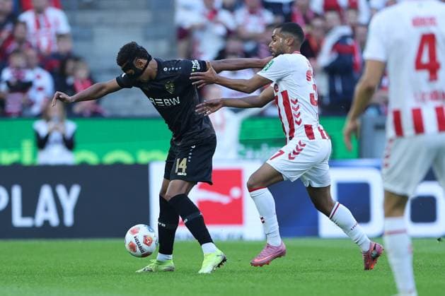 GER, 1 FBL, 1 FC Koeln vs VfB Stuttgart 28 09 2025, Rheinenergie Stadion, Koeln, GER, 1 FBL, 1 FC Koeln vs VfB Stuttgart, in the picture Luca Jaquez VfB Stuttgart 14 , in a duel against Linton Maina FC Koeln 37 , nordphotoxGmbHx xMeuter nph00351