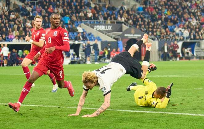 Nick Woltemade of Germany compete for the ball, tackling, duel, header, zweikampf, action, fight against Anthony Moris of Luxembourg in the FIFA World Cup, WM, Weltmeisterschaft, Fussball 2026 qualifier match GERMANY - LUXEMBURG in Season 2025 2026 at October 10, 2025 in Sinsheim, Germany.