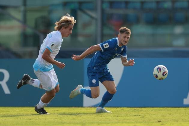 Serravalle, Italy, 12th October 2025. Marinos Tzionis of Cyprus takes on Matteo Sammaritani of San Marino during the San Marino vs Cyprus FIFA World Cup, WM, Weltmeisterschaft, Fussball European Qualifying match at San Marino Stadium, Serravalle. Picture credit should read: Jonathan Moscrop Sportimage EDITORIAL USE ONLY. No use with unauthorised audio, video, data, fixture lists, club league logos or live services. Online in-match use limited to 120 images, no video emulation. No use in betting, games or single club league player publications. SPI_016_JM_SANMARINO_CYPRUS_EQ SPI-4191-0016