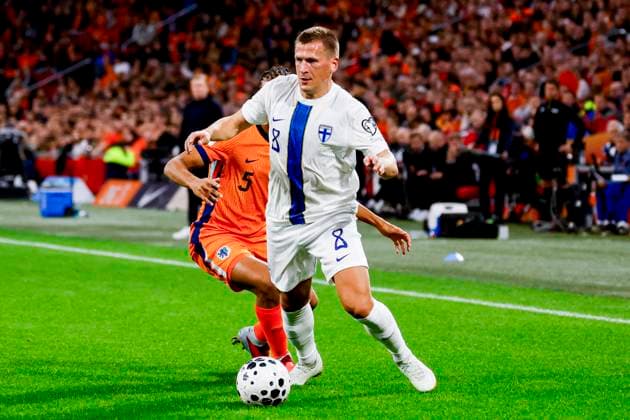 Robin Lod of Finland dribbles with the ball under pressure from Nathan Akà of the Netherlands Netherlands v Finland, FIFA World Cup, WM, Weltmeisterschaft, Fussball 2026 Qualifier, Netherlands v Finland, Johan Cruijff Arena, October 12, 2025, Amsterdam, Netherlands.