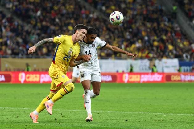 SOCCER - FIFA WC quali, ROU vs AUT BUCHAREST,ROMANIA,12.OCT.25 - SOCCER - FIFA World Cup, WM, Weltmeisterschaft, Fussball 2026, European Qualifiers, group stage, OEFB international match, Länderspiel, Nationalmannschaft Romania vs Austria. Image shows Dennis Man (ROU) and Phillipp Mwene (AUT). GEPAxpictures xArminxRauthner