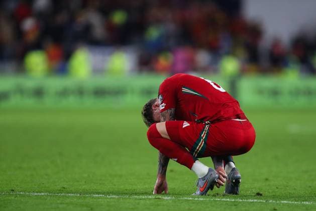 Cardiff, Wales, 13th October 2025. Joe Rodon of Wales reacts to his team s loss after the Wales vs Belgium FIFA World Cup, WM, Weltmeisterschaft, Fussball European Qualifying match at the Cardiff City Stadium, Cardiff. Picture credit should read: Gareth Evans Sportimage EDITORIAL USE ONLY. No use with unauthorised audio, video, data, fixture lists, club league logos or live services. Online in-match use limited to 120 images, no video emulation. No use in betting, games or single club league player publications. SPI_055_GE_WAL_vs_BEL SPI-4214-0053