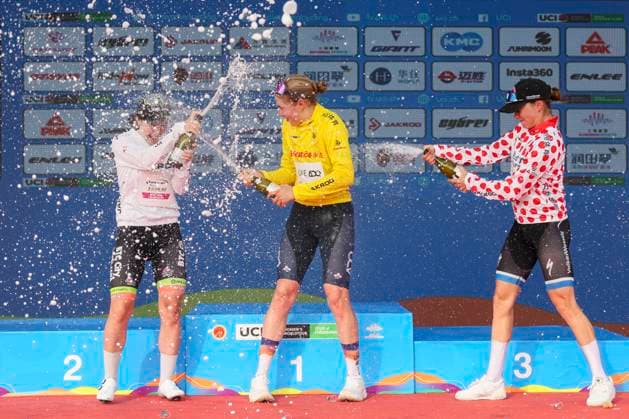 (251015) -- SHANGHAI, Oct. 15, 2025 -- Sofie Van Rooijen (C) of UAE Team ADQ, in the yellow jersey, Anne Knijnenburg (R) of Volkerwessels Cycling Team, in the polka-dot jersey, and Yelizaveta Sklyarova of Born to Win BTC City Ljubljana Zhiraf, in the white jersey, celebrate on the podium after Stage 2 of the UCI Women s WorldTour Tour of Chongming Island Road cycling, Rad, Radsport, Strasse race in Shanghai, east China, Oct. 15, 2025. ) (SP)CHINA-SHANGHAI-CYCLING-UCI WOMEN S WORLDTOUR-TOUR OF CHONGMING ISLAND (CN) WangxXiang