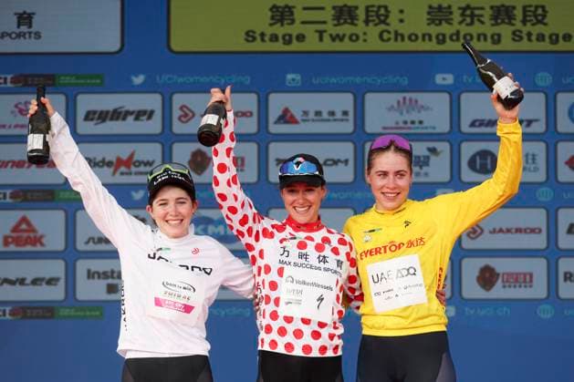 (251015) -- SHANGHAI, Oct. 15, 2025 -- Sofie Van Rooijen (R) of UAE Team ADQ, in the yellow jersey, Anne Knijnenburg (C) of Volkerwessels Cycling Team, in the polka-dot jersey, and Yelizaveta Sklyarova of Born to Win BTC City Ljubljana Zhiraf, in the white jersey, celebrate on the podium after Stage 2 of the UCI Women s WorldTour Tour of Chongming Island Road cycling, Rad, Radsport, Strasse race in Shanghai, east China, Oct. 15, 2025. ) (SP)CHINA-SHANGHAI-CYCLING-UCI WOMEN S WORLDTOUR-TOUR OF CHONGMING ISLAND (CN) WangxXiang