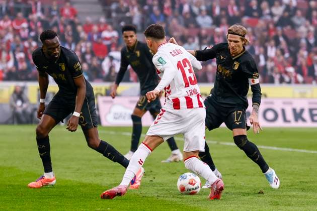 KOELN, GERMANY - OCTOBER 18: Said el Mala (1. FC Koeln, 13) fighting against three defenders of Augsburg, on the left Chrislain Matisma (FC Augsburg, 5), on the right Kristijan Jakic (FC Augsburg, 17), in the back Noahkai Banks (FC Augsburg, 40) during the Bundesliga match between 1. FC Koeln vs. FC Augsburg at the Rheinenergie-Stadion on matchday 7 of the 1. Bundesliga on October 18, 2025 in Koeln, Germany. DFL REGULATIONS PROHIBIT ANY USE OF PHOTOGRAPHS AS IMAGE SEQUENCES AND OR QUASI-VIDEO. Nordrhein-Westfalen Germany Copyright: xBEAUTIFULxSPORTS AxelxKohringx