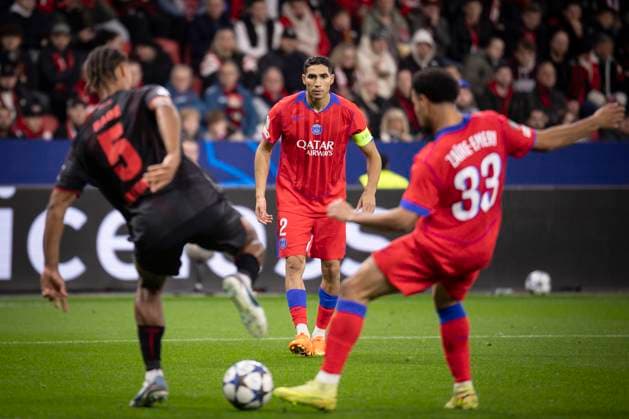 UEFA Champions League, Bayer 04 Leverkusen vs Paris Saint Germain, 21 10 2025 LEVERKUSEN, GERMANY OCTOBER 21 Loic Bade Bayer 04 Leverkusen, 5 , Achraf Hakimi Paris St Germain, 2 , Warren Zaire Emery Paris St Germain, 33 during the UEFA Champions League match on gameday 3 between Bayer 04 Leverkusen vs Paris Saint Germain at BayArena on October 21, 2025 in Leverkusen, Germany DFL REGULATIONS PROHIBIT ANY USE OF PHOTOGRAPHS AS IMAGE SEQUENCES AND OR QUASI VIDEO Copyright: xBEAUTIFULxSPORTS AxelxKohringx