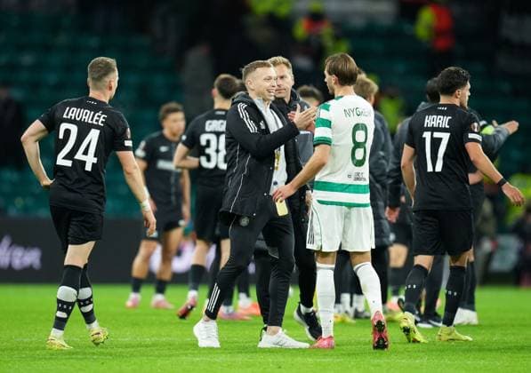 Alistair Johnston of Celtic on the pitch with Benjamin Nygren of Celtic at full-time. Final score Celtic 2 Sturm Graz 1. Celtic v Sturm Graz, UEFA Europa League, Group Stage, Football, Celtic Park, Glasgow, Scotland, UK - 23 Oct 2025Glasgow Celtic Park United Kingdom EDITORIAL USE ONLY No use with unauthorised audio, video, data, fixture lists, club league logos or live services. Online in-match use limited to 120 images, no video emulation. No use in betting, games or single club league player publications. Copyright: xStuartxWallace Shutterstockx 15567786dq
