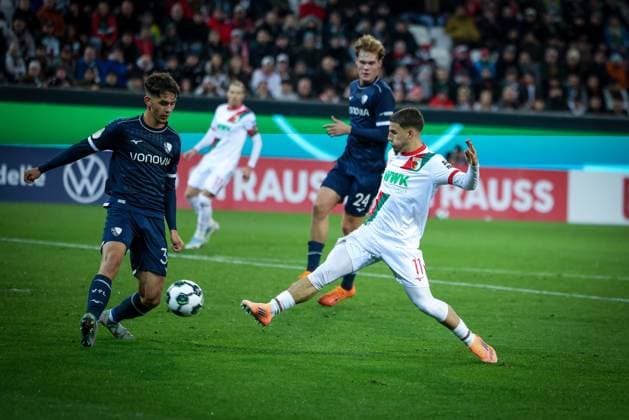 Ismael Gharbi 11 FC Augsburg shoots the ball on goal, against Cajetan Lenz 34 VfL Bochum , FC Augsburg vs VfL Bochum 1848, Football, Men, DFL, DFB Pokal, Season 2025 2026, WWK Arena, Second round, 28 10 2025 Augsburg Bayern Germany Copyright: xkolbert-press MartinxAgüerax