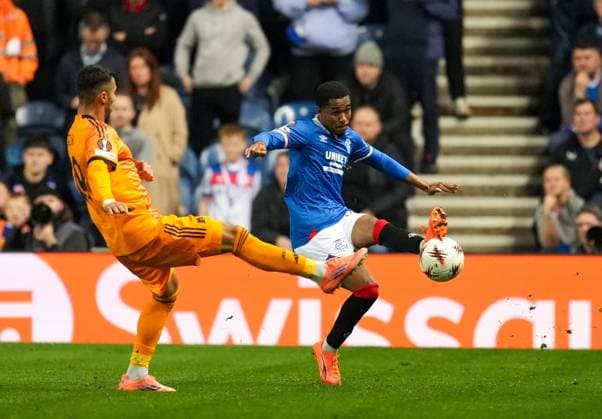 Jayden Meghoma of Rangers challenged by Zeki Celik of AS Roma Rangers v Roma, UEFA Europa League, Group Stage, Football, Ibrox Stadium, Glasgow, Scotland, UK - 06 Nov 2025Glasgow Ibrox Scotland United Kingdom EDITORIAL USE ONLY No use with unauthorised audio, video, data, fixture lists, club league logos or live services. Online in-match use limited to 120 images, no video emulation. No use in betting, games or single club league player publications. Copyright: xStuartxWallace Shutterstockx 15642261ab