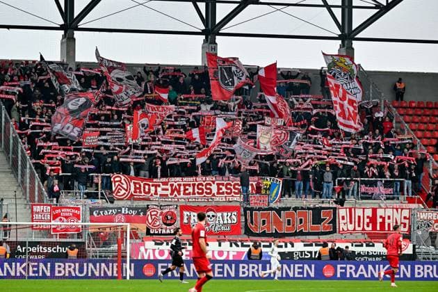Fans of Rot Weiss Essen show their scarves and make mood, Fans, Audience, Spectators, Atmosphaere, Stadium, 08 11 2025, Ingolstadt Germany , Soccer, 3 Liga, FC Ingolstadt 04 Rot Weiss Essen, DFB DFL REGULATIONS PROHIBIT ANY USE OF PHOTOGRAPHS AS IMAGE SEQUENCES AND OR QUASI VIDEO xslx