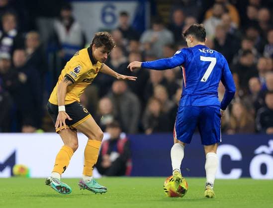 Pedro Neto of Chelsea in action against Hugo Bueno of Wolverhampton Wanderers Chelsea v Wolverhampton Wanderers, Premier League, Football, Stamford Bridge, London, UK - 08 Nov 2025London Stamford Bridge United Kingdom EDITORIAL USE ONLY No use with unauthorised audio, video, data, fixture lists, club league logos or live services. Online in-match use limited to 120 images, no video emulation. No use in betting, games or single club league player publications. Copyright: xGeorgexTewkesbury Shutterstockx 15702174y