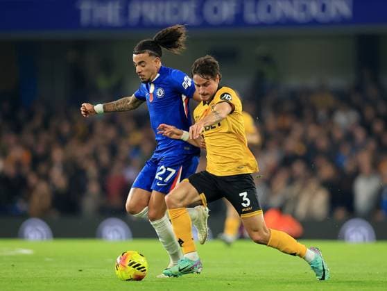 Hugo Bueno of Wolverhampton Wanderers in action against Malo Gusto of Chelsea Chelsea v Wolverhampton Wanderers, Premier League, Football, Stamford Bridge, London, UK - 08 Nov 2025London Stamford Bridge United Kingdom EDITORIAL USE ONLY No use with unauthorised audio, video, data, fixture lists, club league logos or live services. Online in-match use limited to 120 images, no video emulation. No use in betting, games or single club league player publications. Copyright: xGeorgexTewkesbury Shutterstockx 15702174am