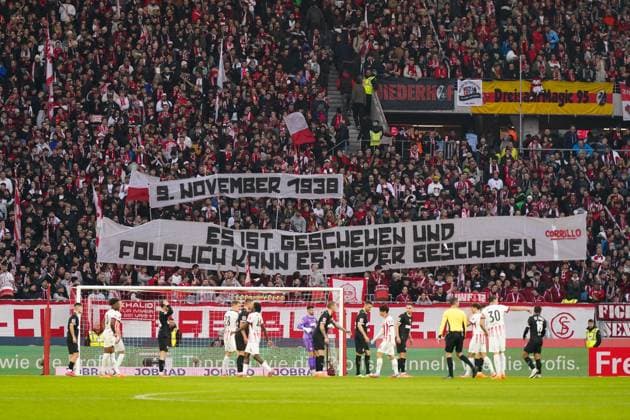 Germany, Freiburg, Europe, Bundesliga 2025 26, Matchday 10 SC Freiburg vs FC St Pauli, Europa Park Stadion, home curve, commemorative banner, 9 November 1938, culture of remembrance, anti-Semitism reminder, democracy, responsibility, history, fan culture, solidarity, stadium, Bundesliga Freiburg im Breisgau Baden Württemberg Germany Copyright: xJOERANxSTEINSIEKx