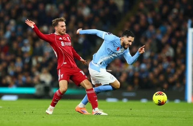 Alexis Mac Allister of Liverpool and Rayan Cherki of Manchester City Manchester City v Liverpool, Premier League, Football, Etihad Stadium, Manchester, UK - 09 Nov 2025Manchester Etihad Stadium United Kingdom EDITORIAL USE ONLY No use with unauthorised audio, video, data, fixture lists, club league logos or live services. Online in-match use limited to 120 images, no video emulation. No use in betting, games or single club league player publications. Copyright: xPaulxCurrie Shutterstockx 15702266u