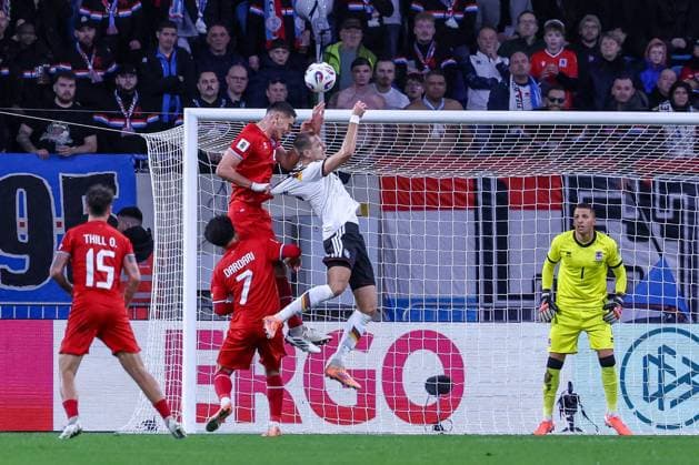Thrilling header with Waldemar Anton Germany , Anthony Morris 1 Luxembourg Luxembourg watching, Luxembourg vs Germany, Football, Men, World Cup Qualification, Country Match, Group Stage, Group A, Stade de Luxembourg, UEFA,14 11 2025 Luxembourg City Luxembourg Copyright: xkolbert-press MartinxAgüerax