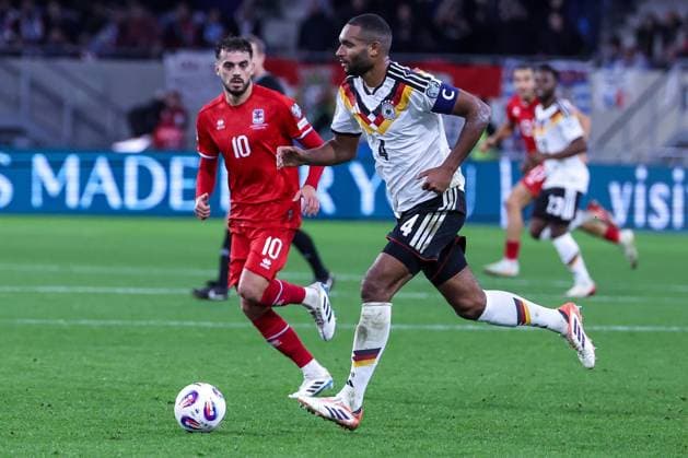Jonathan Tah 4 Germany in action against Daniel Sinani 10 Luxembourg Luxembourg , Luxembourg vs Germany, Football, Men, World Cup Qualification, Group match, Group stage, Group A, Stade de Luxembourg, UEFA,14 11 2025 Luxembourg City Luxembourg Copyright: xkolbert-press MartinxAgüerax