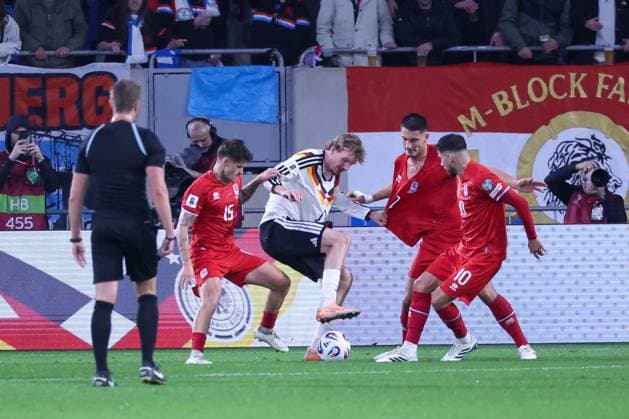 Nick Woltemade 11 Germany in action against Daniel Sinani 10 Luxembourg Luxembourg , Olivier Thill 15 Luxembourg Luxembourg and Seid Korac 2 Luxembourg Luxembourg Luxembourg , Luxembourg vs Germany, Football, Men, World Cup Qualification, Country Match, Group Stage, Group A, Stade de Luxembourg, UEFA,14 11 2025 Luxembourg City Luxembourg Copyright: xkolbert-press MartinxAgüerax