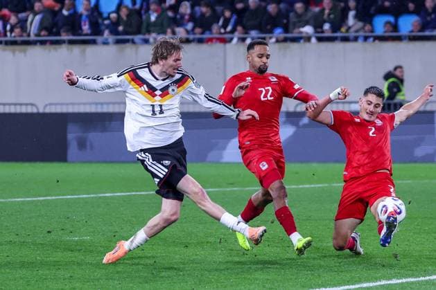 Nick Woltemade 11 Germany with the goal for 0 2, against Marvin Martins 22 Luxembourg Luxembourg and Seid Korac 2 Luxembourg Luxembourg , Luxembourg vs Germany, Football, Men, World Cup Qualification, Country Match, Group stage, Group A, Stade de Luxembourg, UEFA,14 11 2025 Luxembourg City Luxembourg Copyright: xkolbert-press MartinxAgüerax