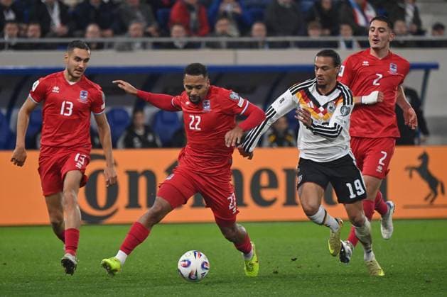 14 11 2025, xjrdrx, Football, World Cup Qualification 2026 Luxembourg Germany emspor, v l Dirk Carlson Luxembourg, 13 , Marvin Martins Luxembourg, 22 , Leroy Sane Germany , Seid Korac Luxembourg, 2 duel, duel, fight, tackle DFL DFB REGULATIONS PROHIBIT ANY USE OF PHOTOGRAPHS as IMAGE SEQUENCES and or QUASI VIDEO Luxembourg