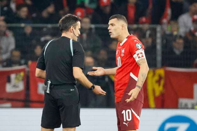 Referee Erik Lambrechts BEL and Granit Xhaka Switzerland, 10 in dialog , Switzerland, FIFA, World Cup Qualification Europe, Group B , Switzerland vs Sweden, 15 11 2025, Stade de Geneve, Geneva, Switzerland Geneva Stade de Geneve Canton Geneva Switzerland Copyright: xGrantxHubbsx