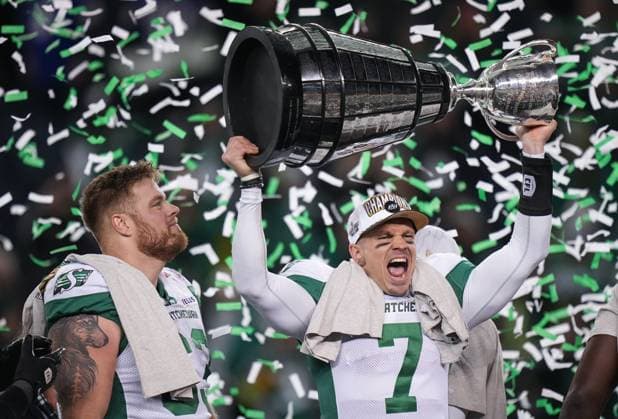 November 17, 2025, Winnipeg, Mb, CANADA: Saskatchewan Roughriders quarterback Trevor Harris hoists the Grey Cup as Logan Ferland, left, watches after Saskatchewan defeated the Montreal Alouettes during the 112th CFL Grey Cup, in Winnipeg, Sunday, Nov. 16, 2025. Canada News - November 17, 2025 - ZUMAc35_ 20251117_zaf_c35_046 Copyright: xDarrylxDyckx